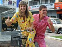 Crazy cyclists pedal along Vietnam in pyjamas